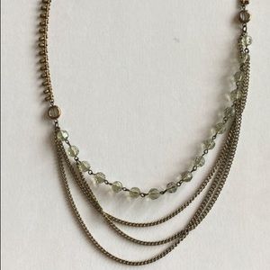 Multi strand long beaded necklace.